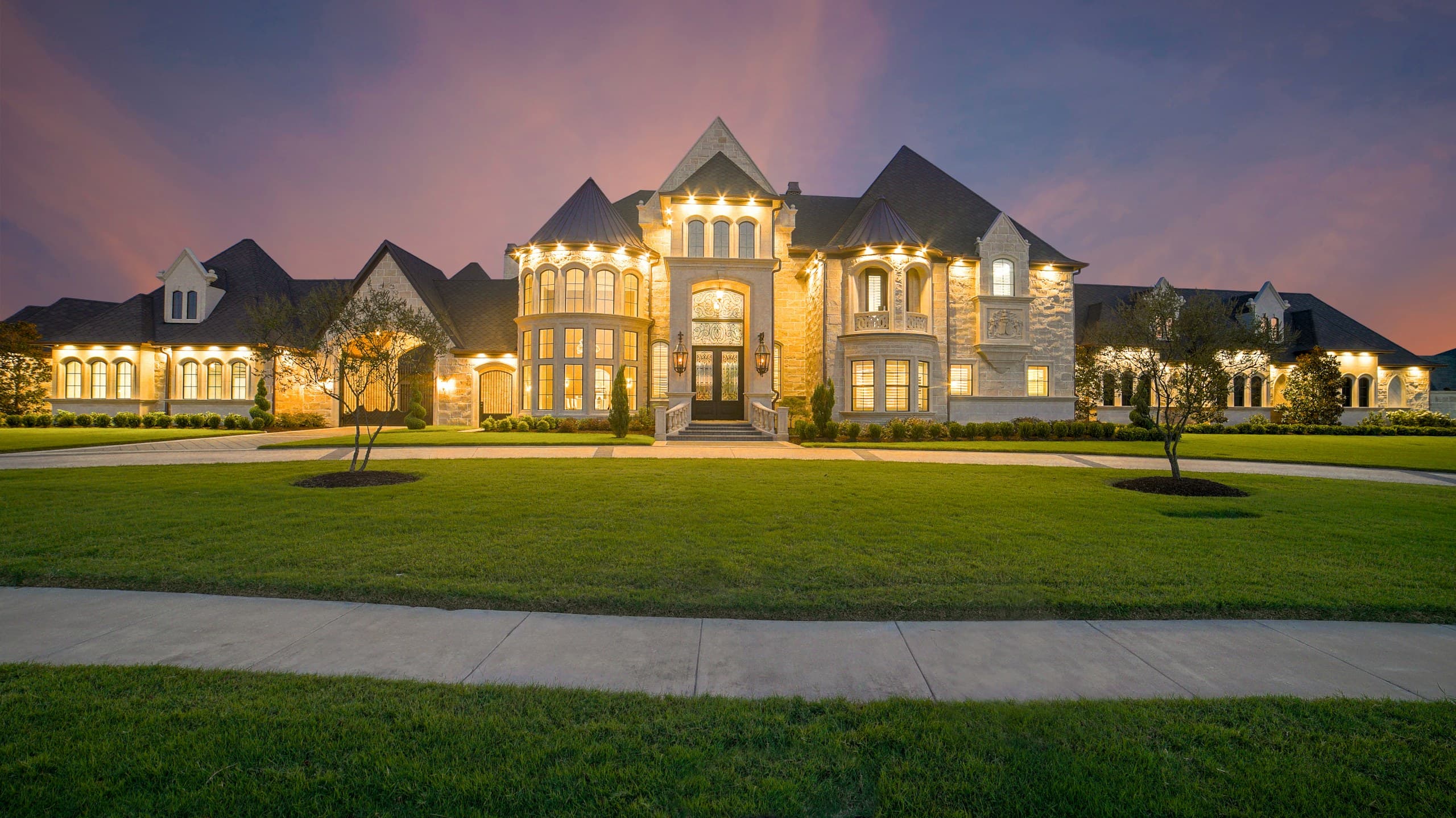 Luxury Connecticut estate glowing at twilight