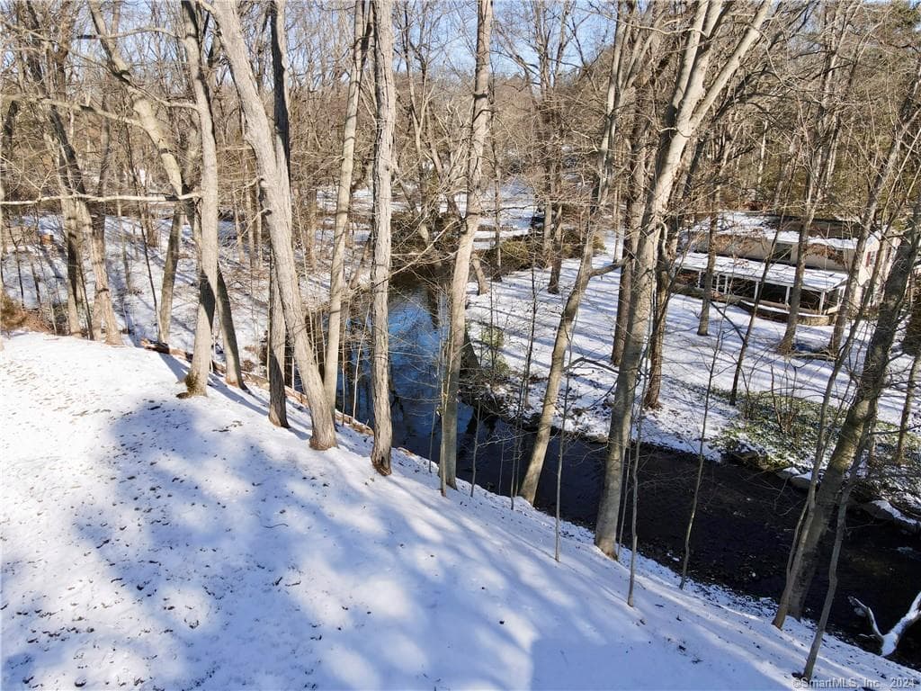 Norwalk River frontage at a wooded Connecticut property